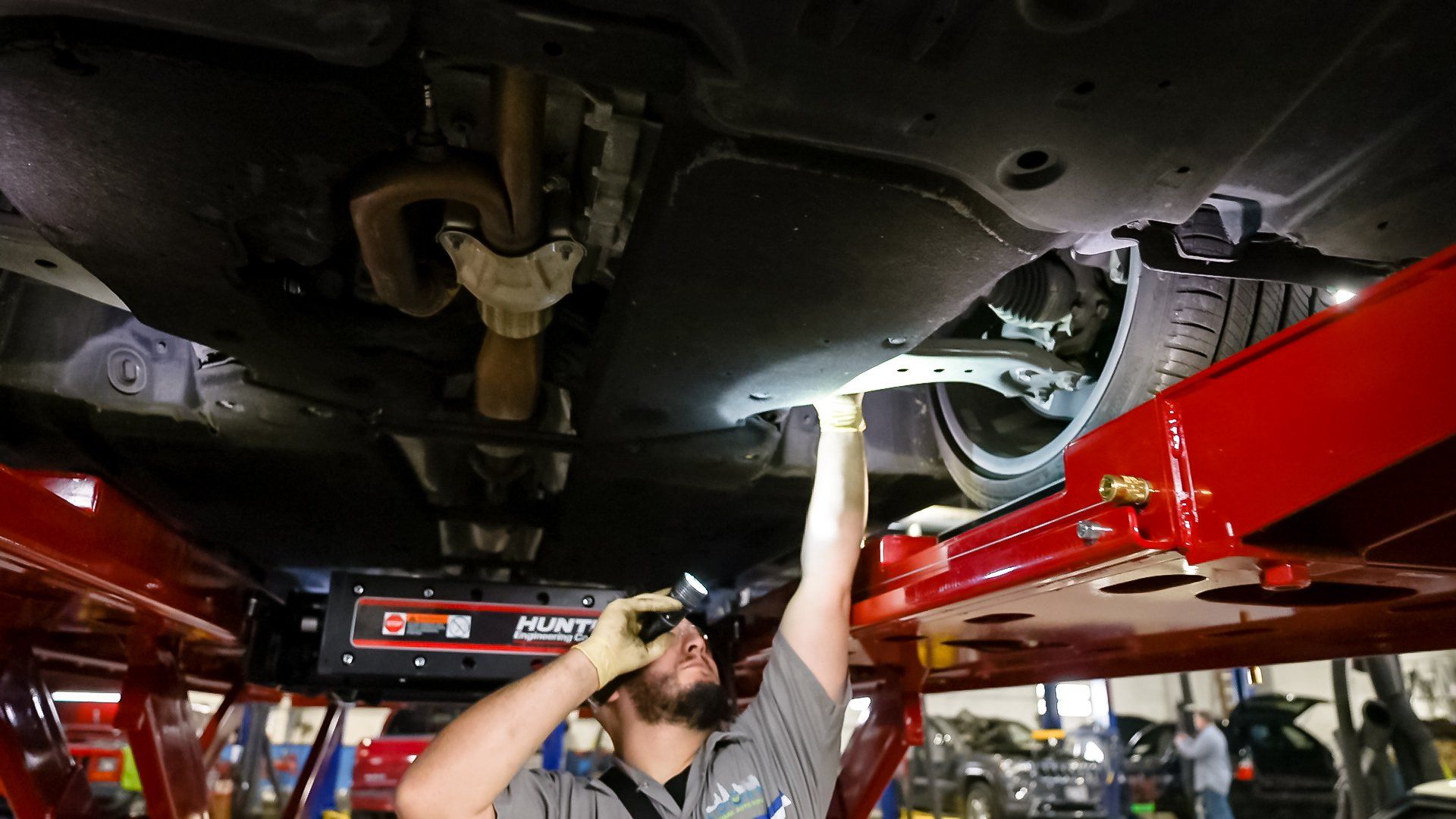 Professional mechanic working on a car engine