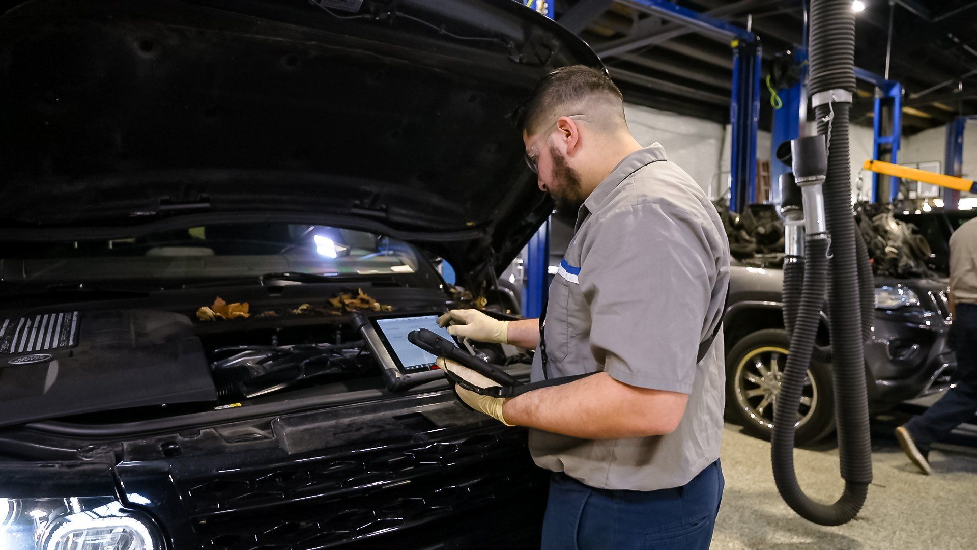 Professional mechanic working on a car engine
