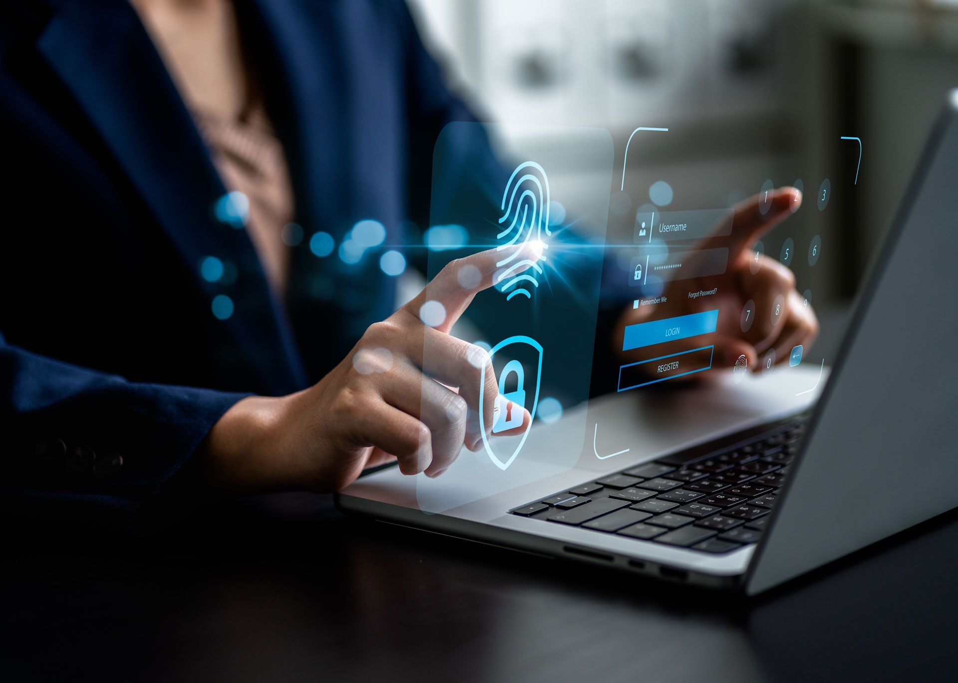 Person unlocking laptop with fingerprint scan, blue digital overlay.