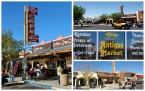 Collage of buildings, including the Coffee Cup Cafe and an antique market. Sunny day, people visible.