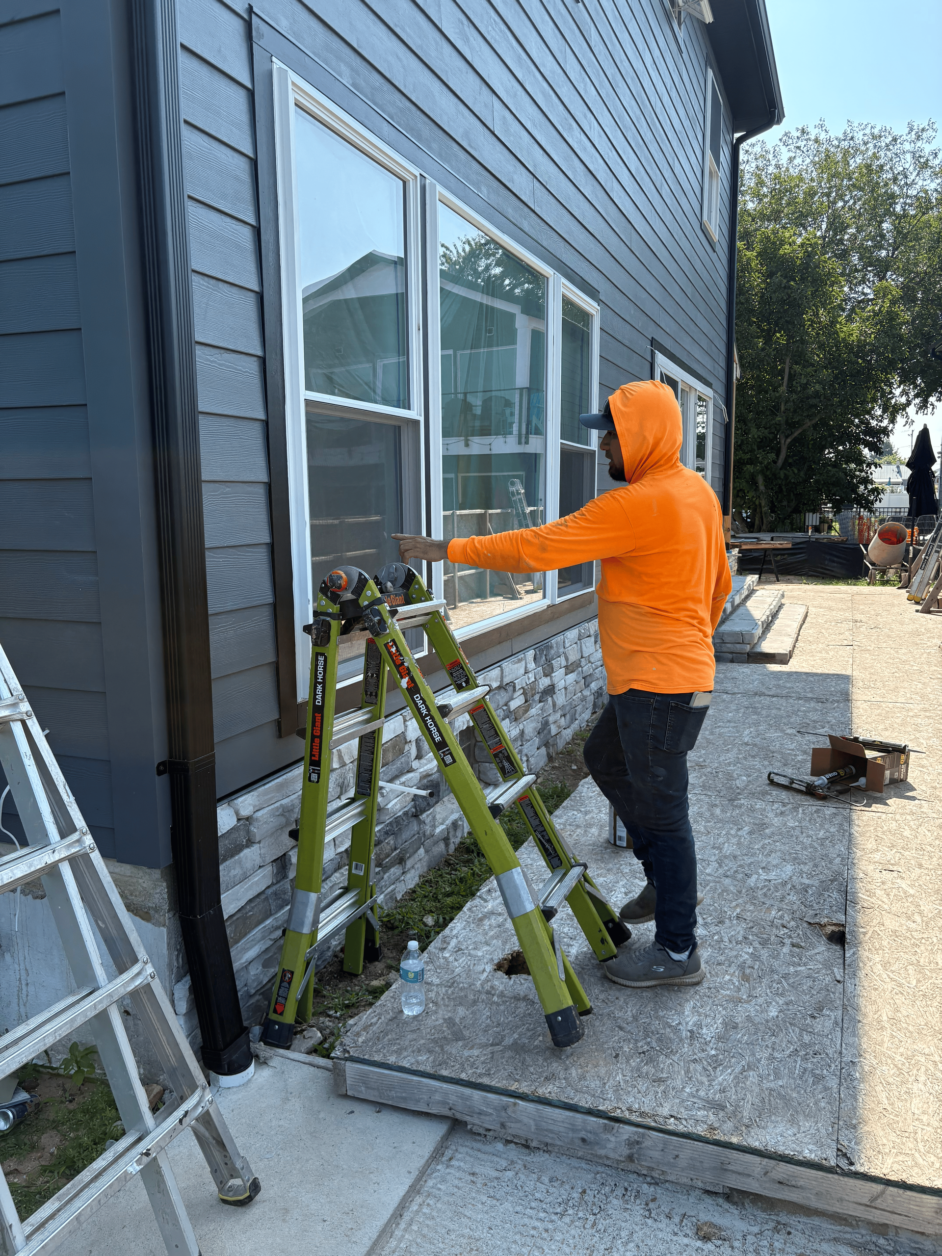 Skilled worker hands carefully arranging and securing roof tiles, creating a durable and precise roofing structure.
