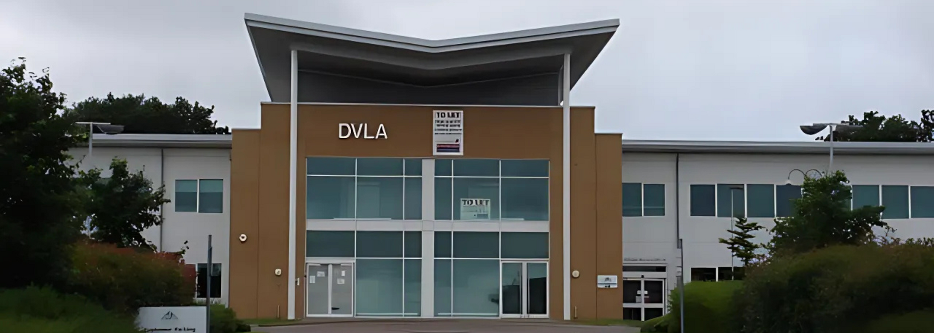 Picture of DVLA logo on building.
