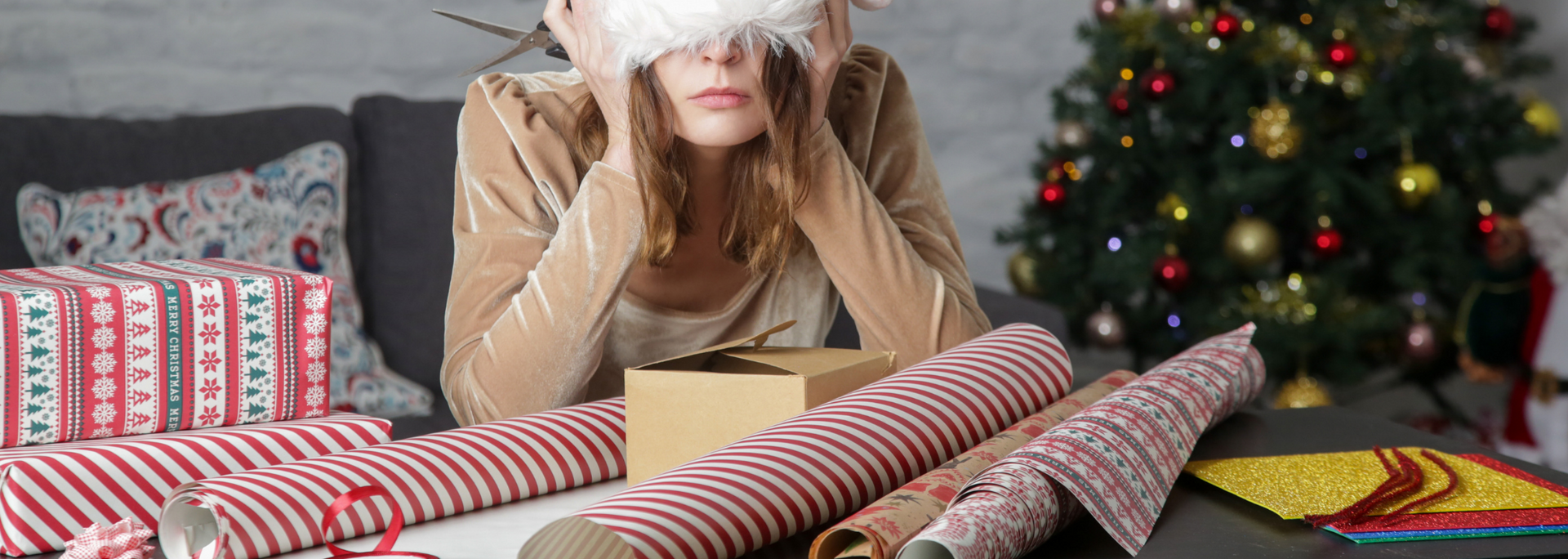Picture of a Depressed frustrated woman wrapping Christmas gift
