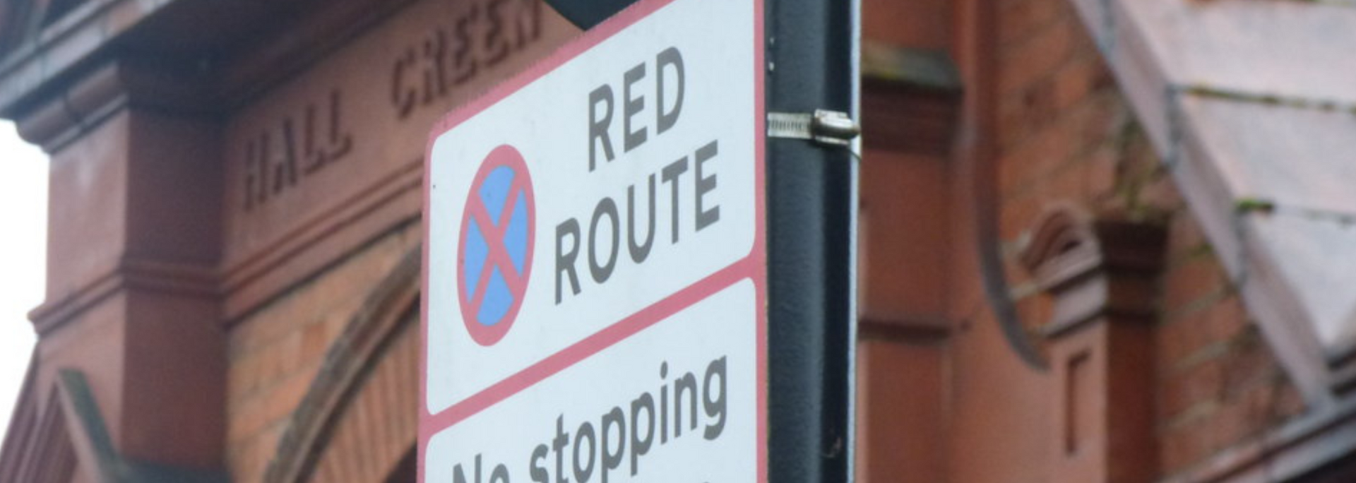 Picture of a red route sign.