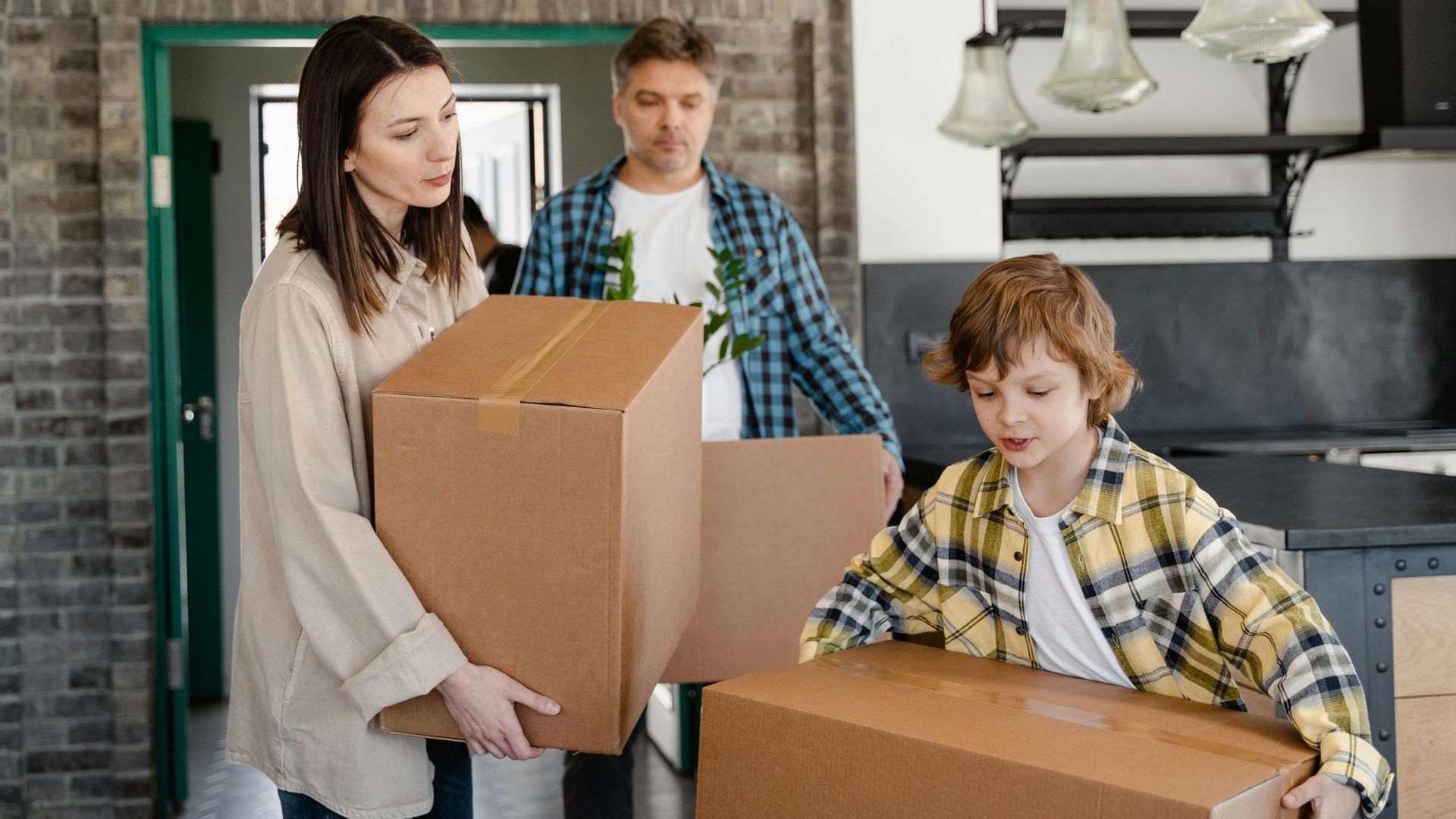 Picture of several people helping to move cardboard boxes