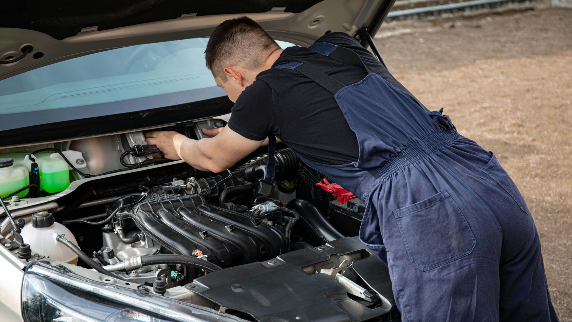 Picture of someone giving a car a good once-over.