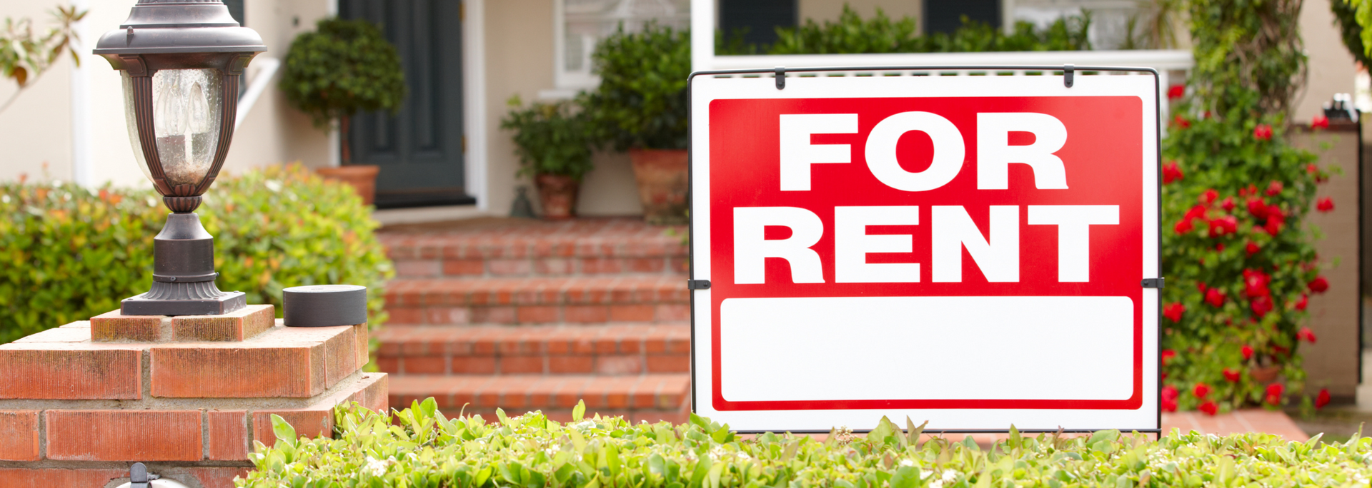 Picture of a 'For Rent' sign on a house. Picture of a 'For Rent' sign on a house.