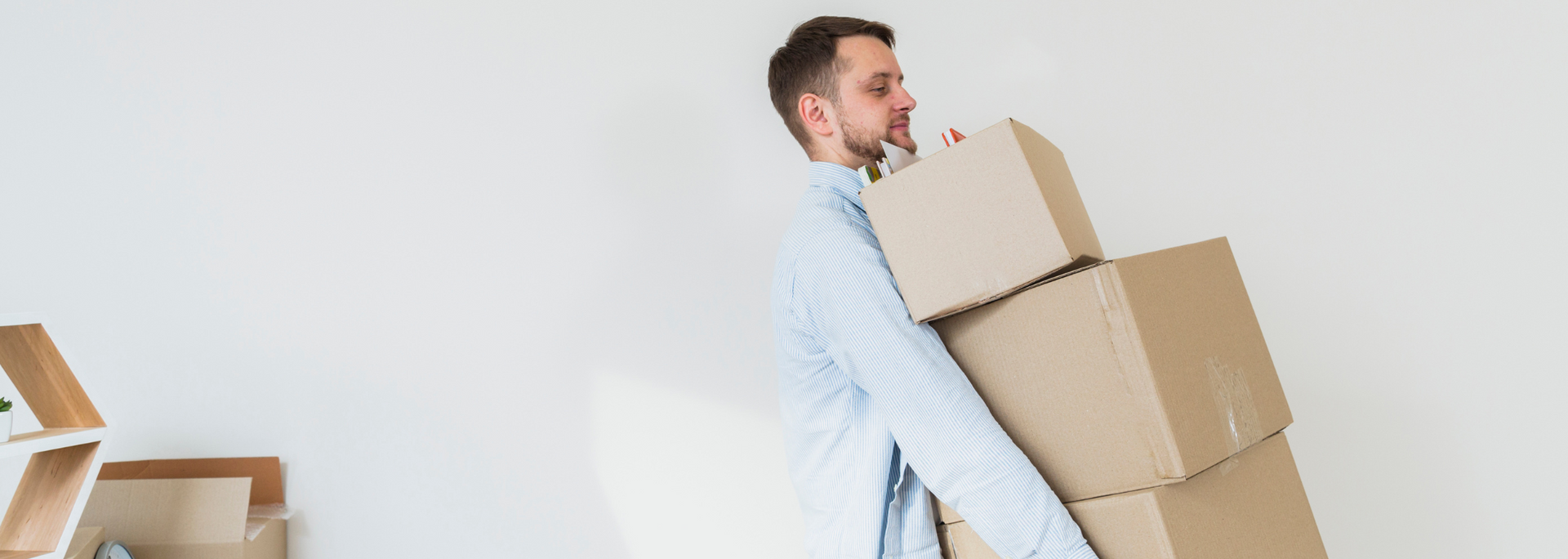 Picture of someone carrying heavy boxes. Picture of someone carrying heavy boxes.