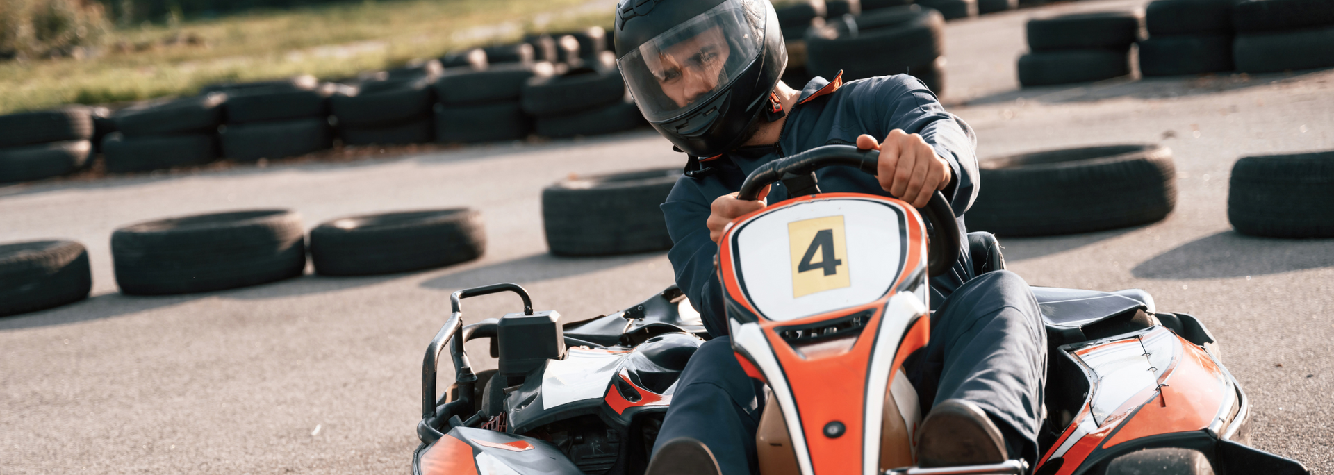 Picture of someone in a go-kart. Picture of someone in a go-kart.