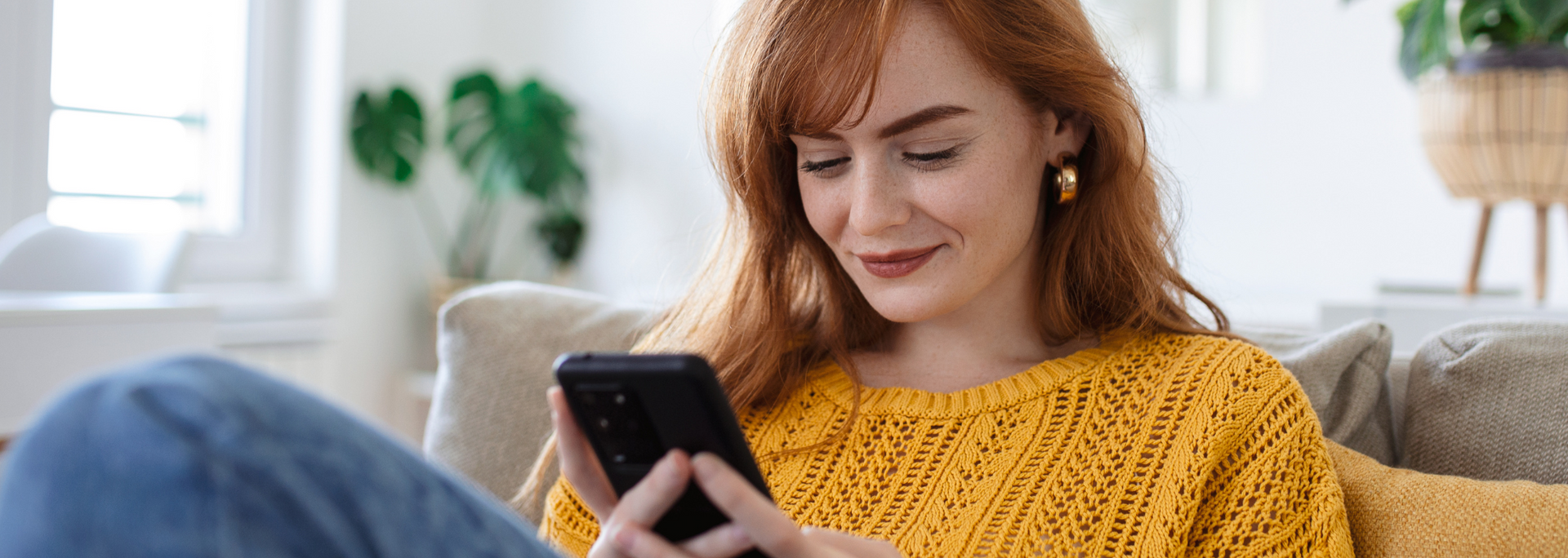 Picture of someone looking happy while using a computer. Picture of someone looking happy while using a computer.