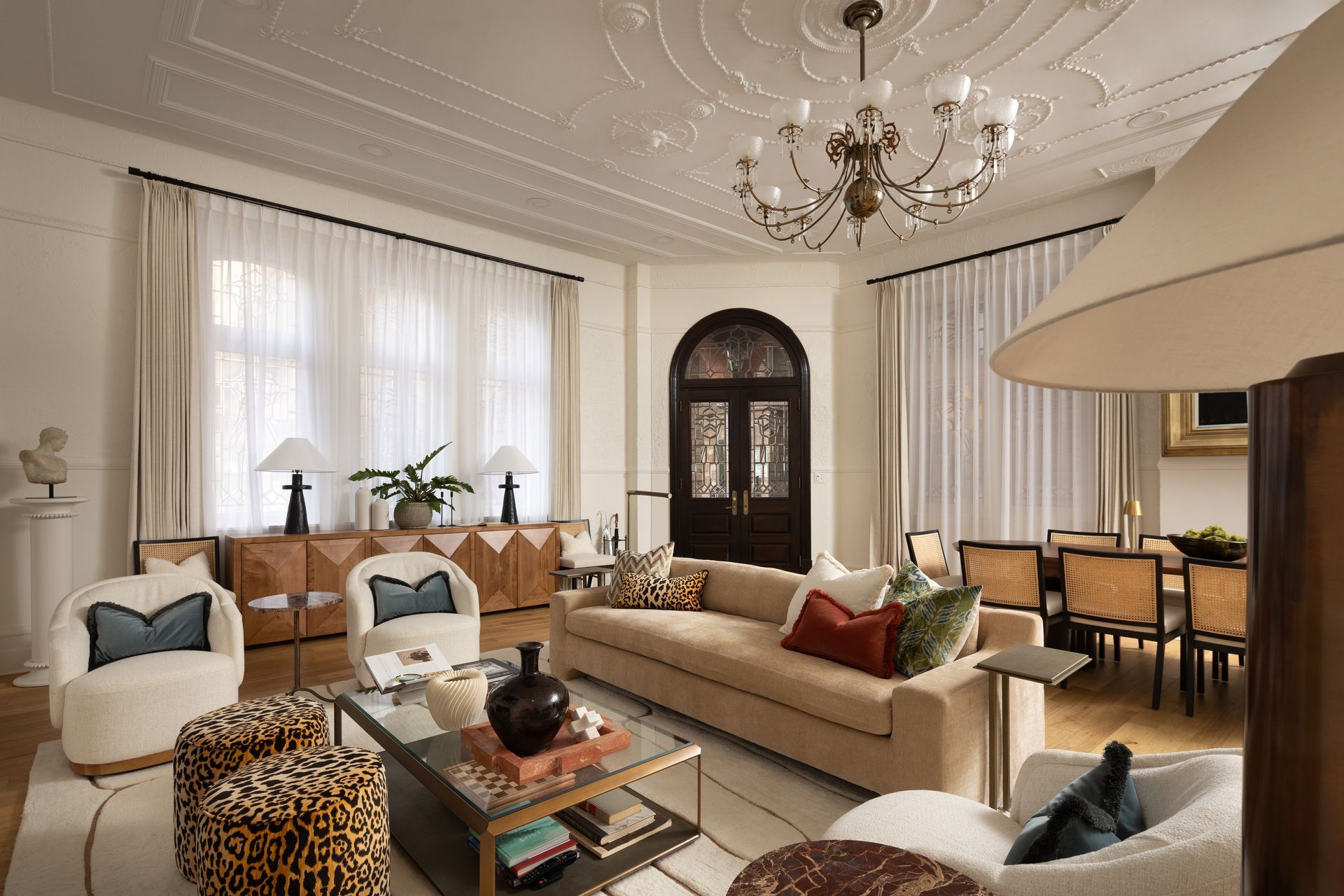 A living room filled with furniture and a chandelier.