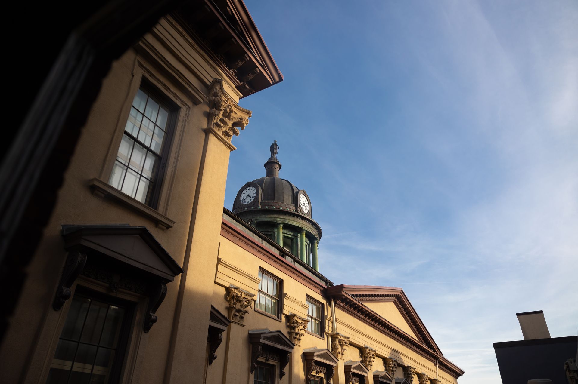 A building with a dome and a clock on top of it