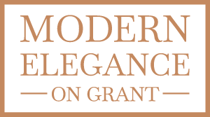 The logo for modern elegance on grant is brown and white