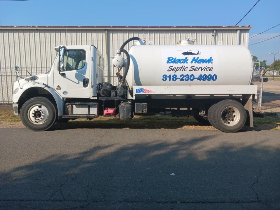White septic service truck parked on a road; Black Hawk Septic Service, 318-230-4990 on the tank.