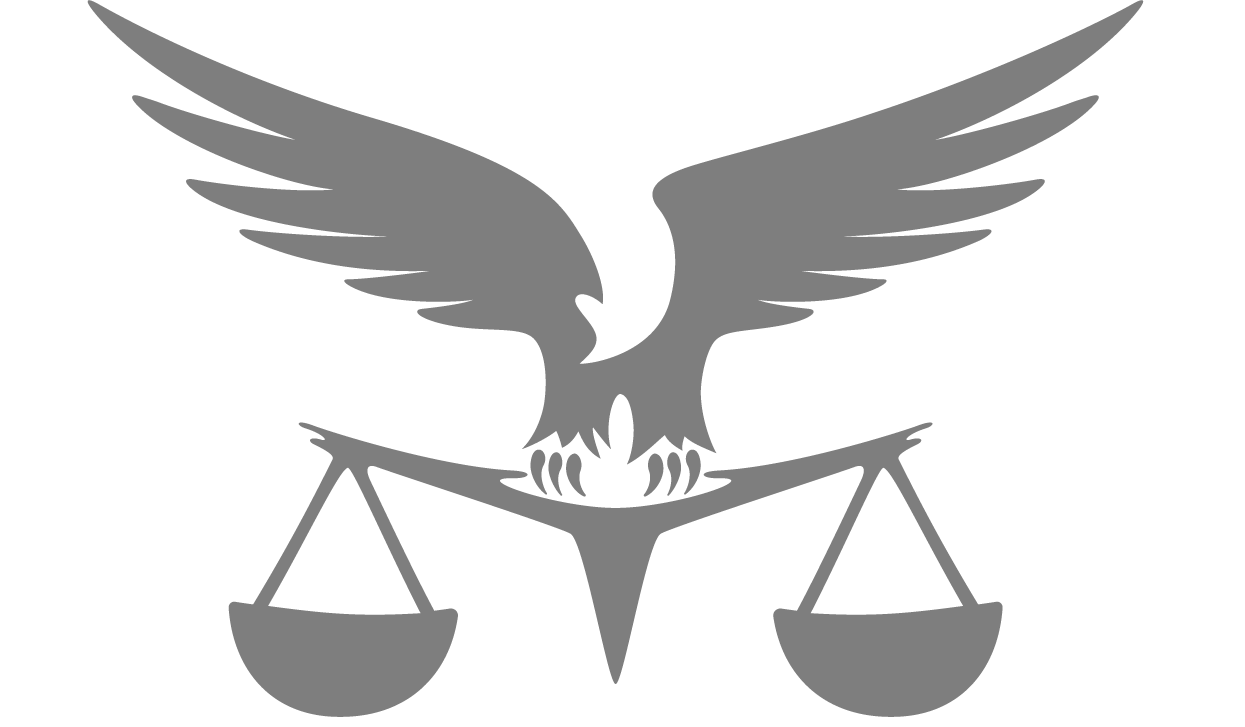 A silhouette of an eagle sitting on top of a scale of justice.