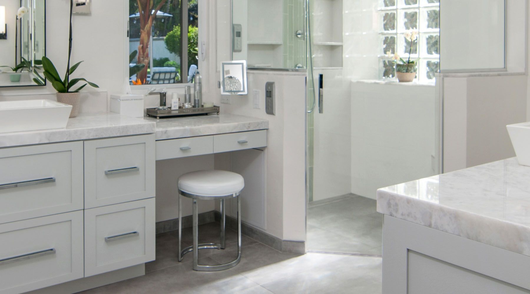 A bathroom with two sinks , a toilet , and a bathtub.