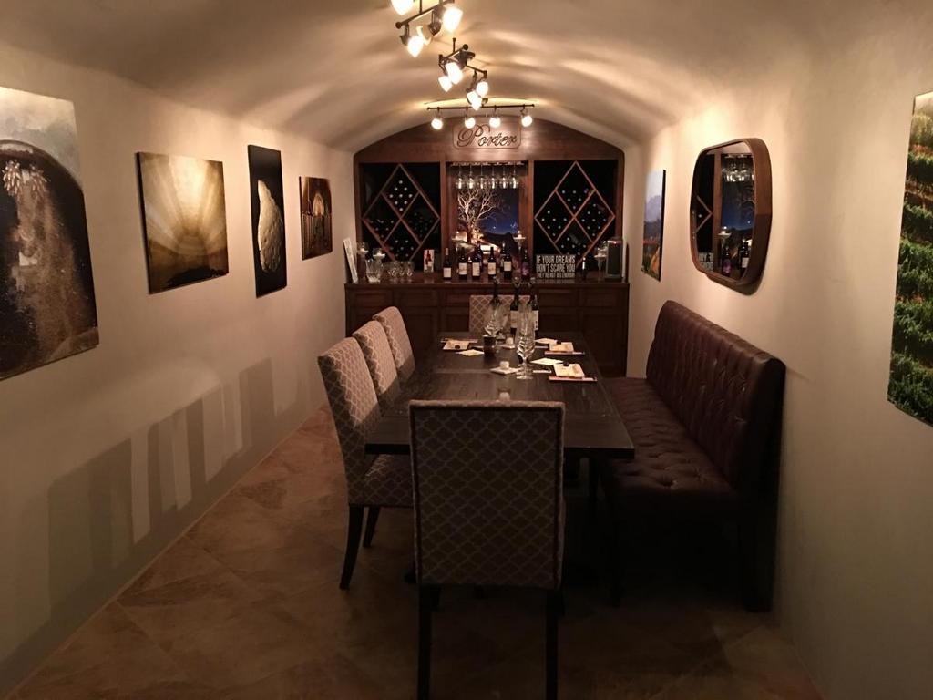 inside an elegant wine cave with pictures on the wall