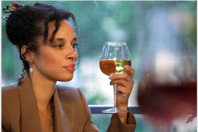 Women holding a wine glass.