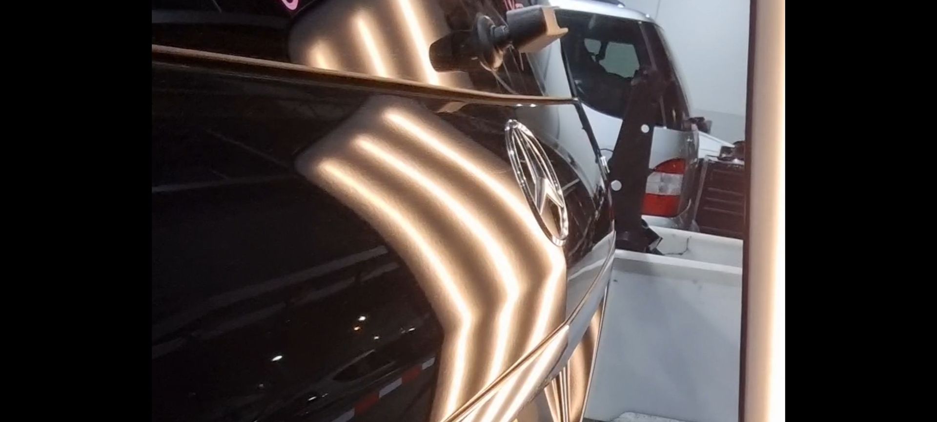 a car with a dent on the side of it