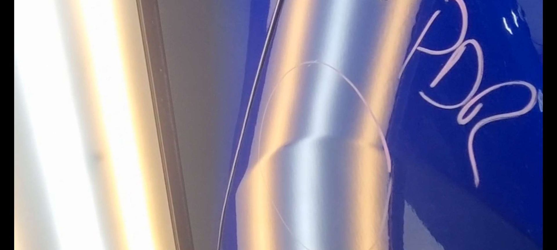 a blue car that had dents removed