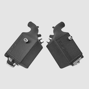 Two black boxes are sitting next to each other on a white surface.