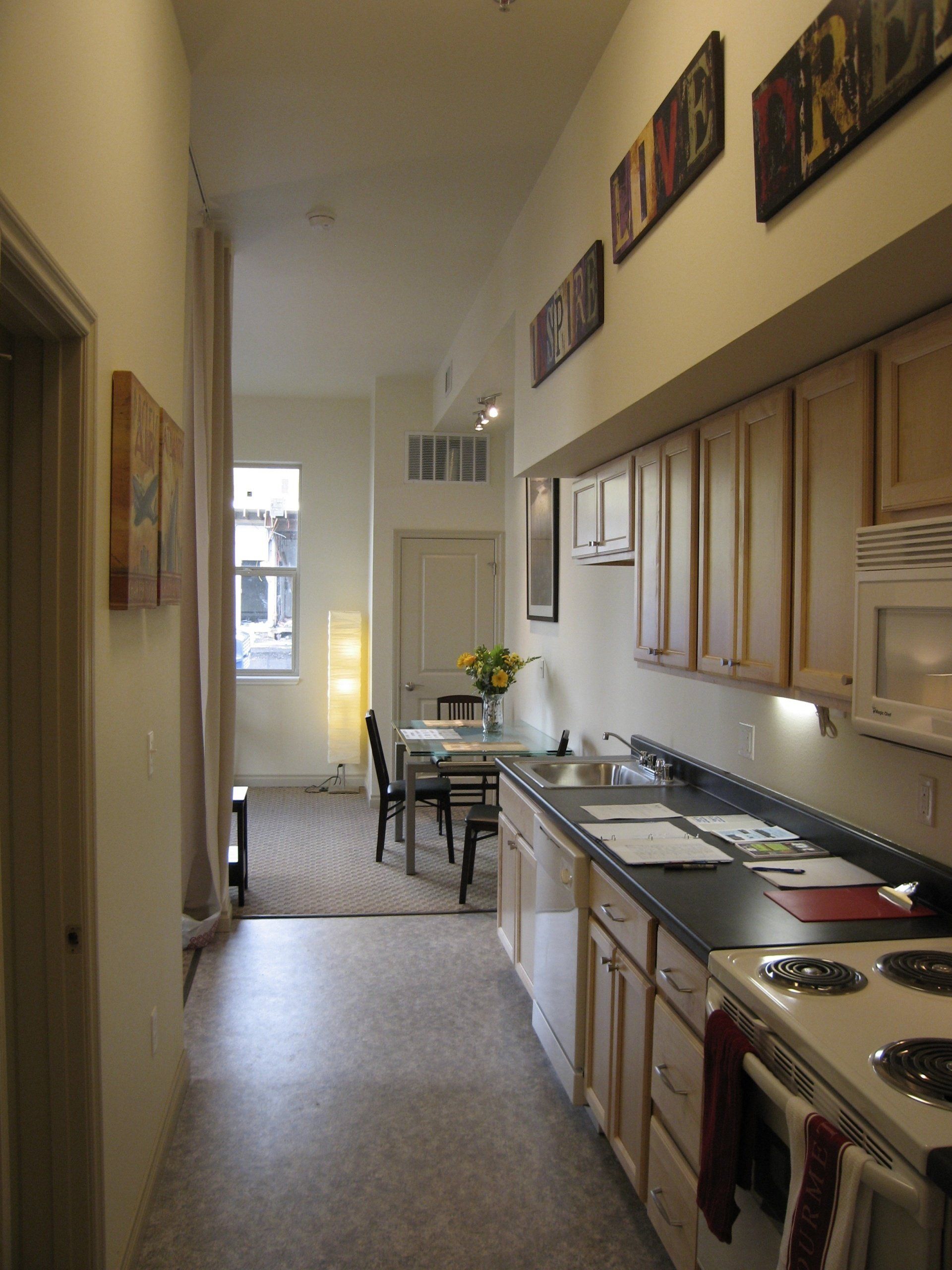 Spruce Kitchen With Living Room In Background Photo