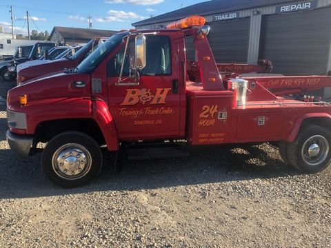 Truck Alignment Frame & Axle Repair — B&H Towing Red Truck in Zanesville, OH