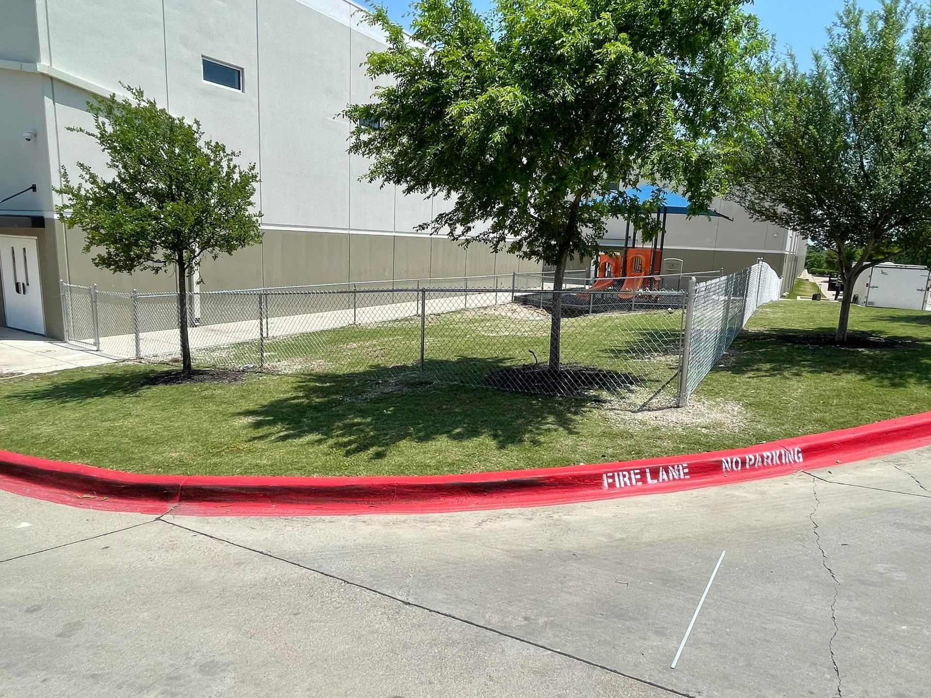 A red curb with the words first lane written on it