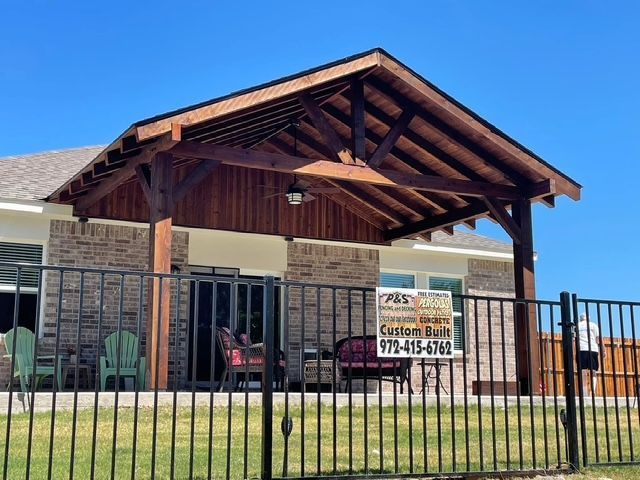 A house with a fence and a sign that says custom built