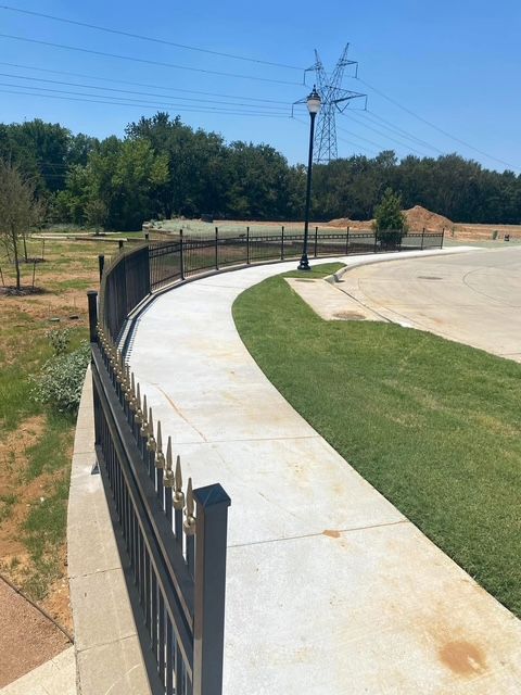 A walkway with a fence along the side of it