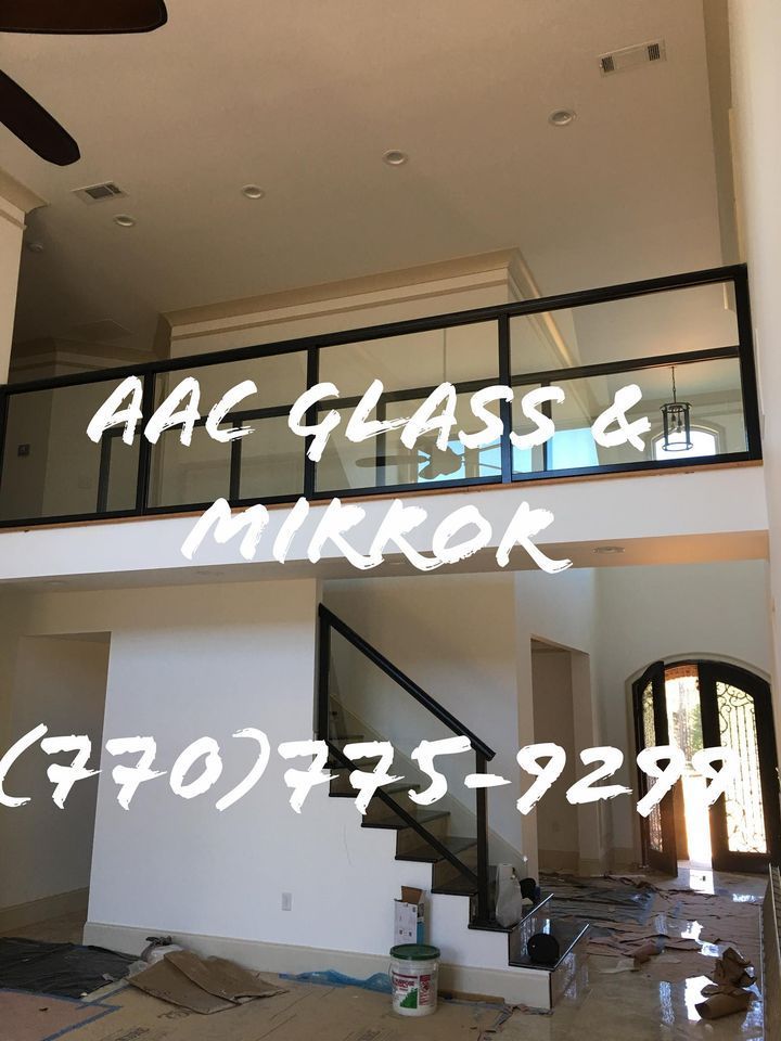 A bathroom with a walk in shower and a mirror.