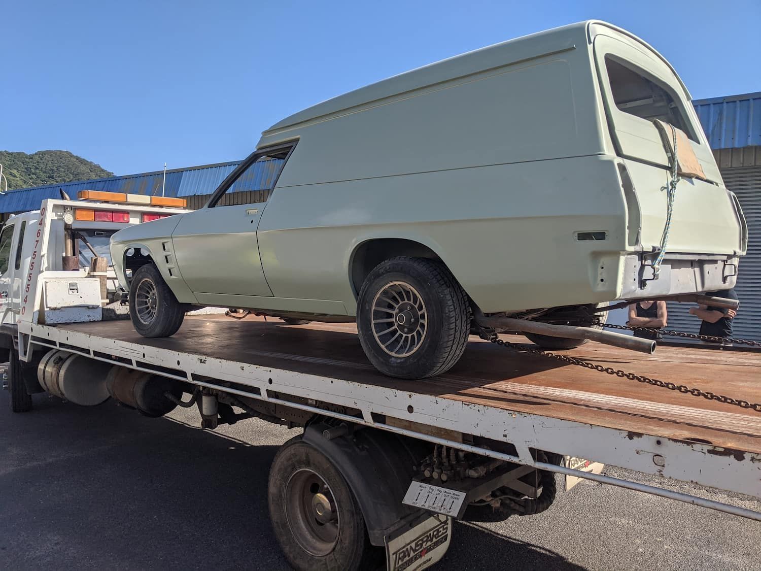 A Vintage Light Green Utility Vehicle With Custom Canopy, on a Flatbed Tow Truck — Ringtail Towing in Mareeba, QLD