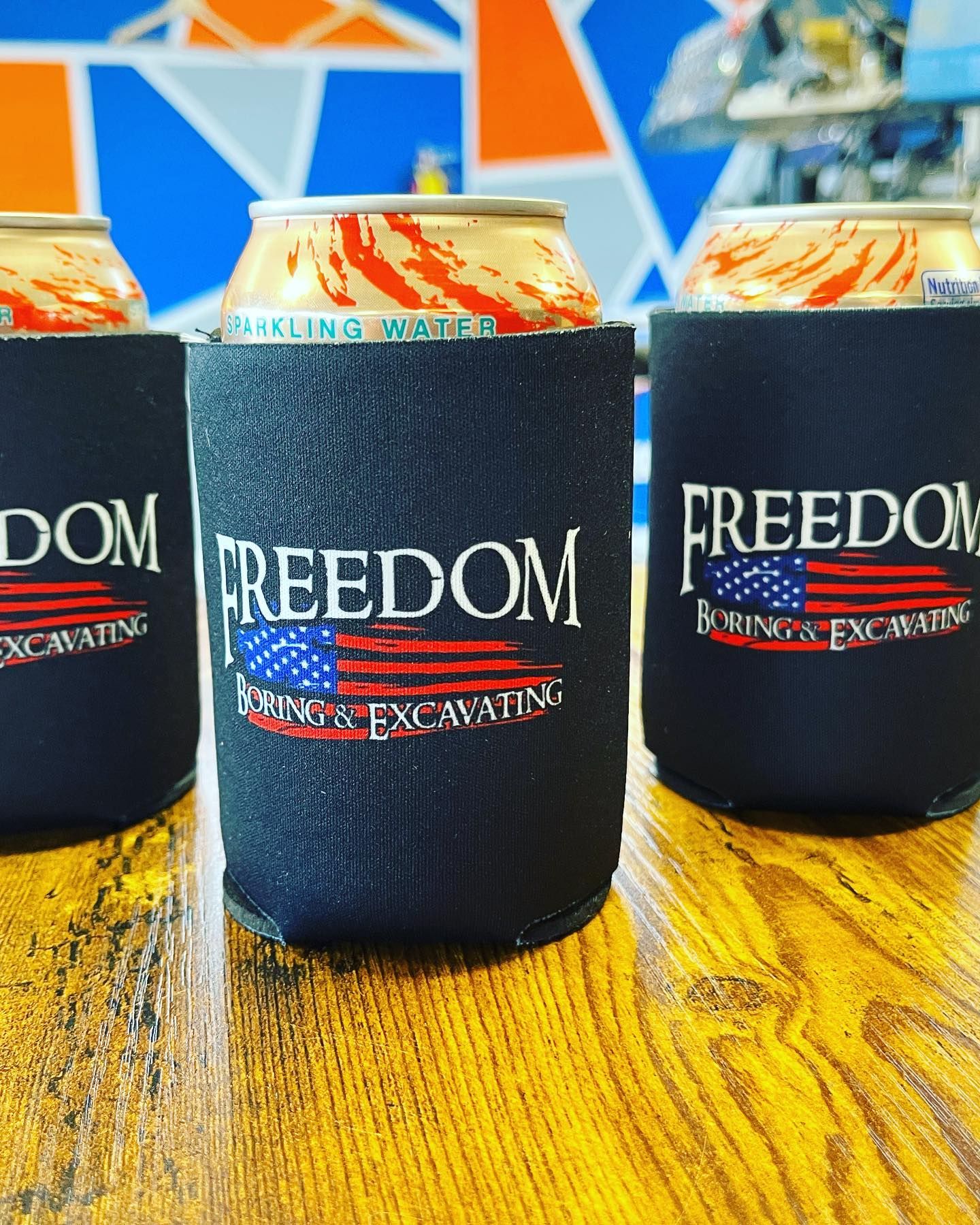 Two shirts and a mug with the h & b electric logo on them