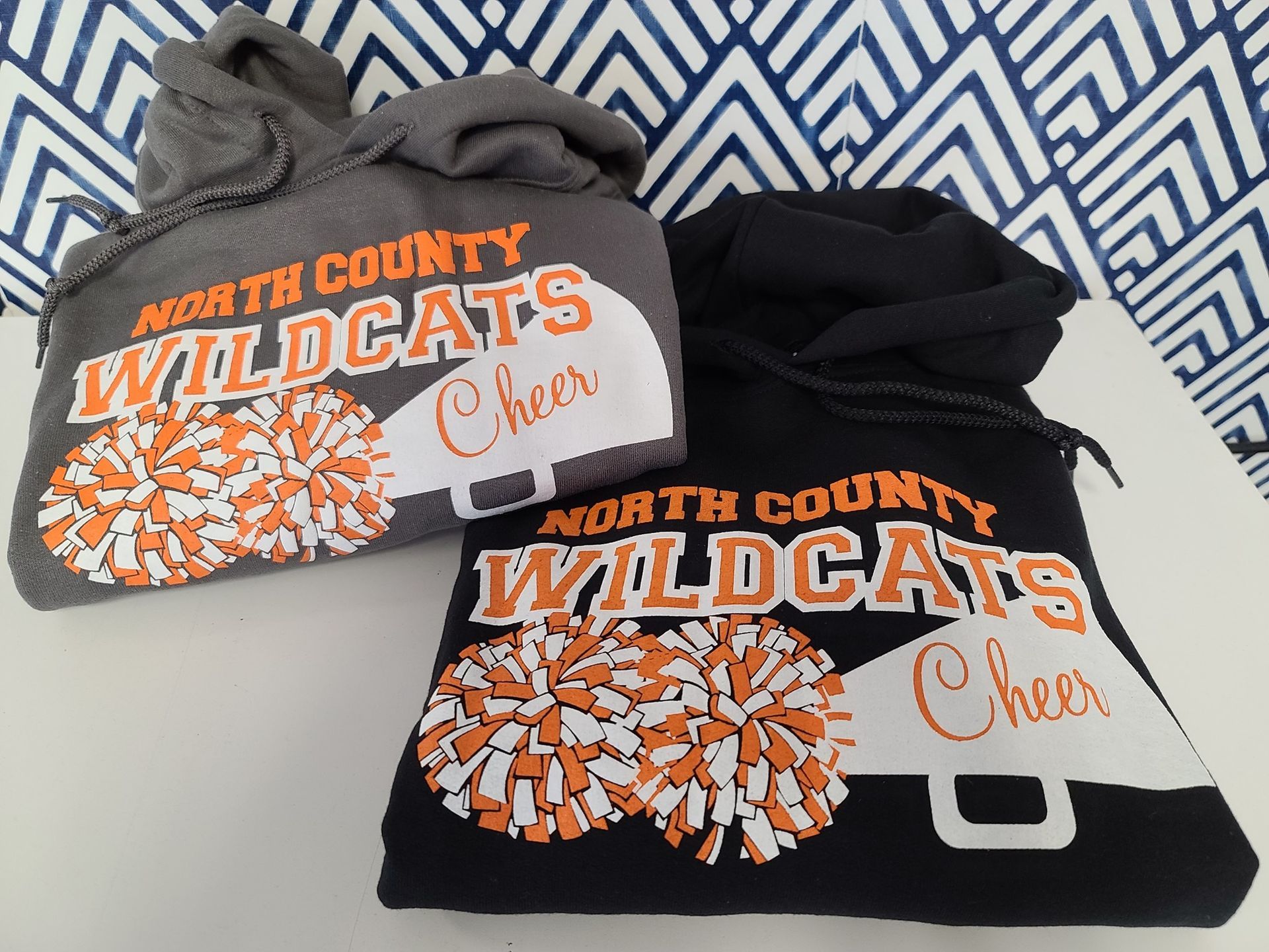 A blue bag that says uptown screen printing on it