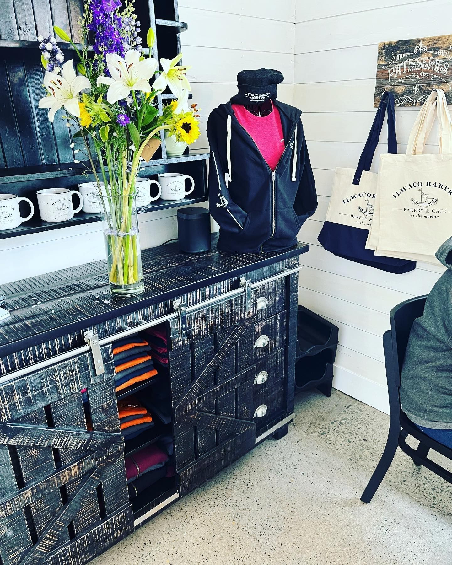 Two shirts and a mug with the h & b electric logo on them