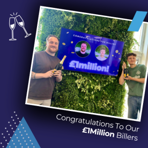 Two men celebrating a £1 million win, holding champagne bottles in front of a green wall and a celebratory sign.
