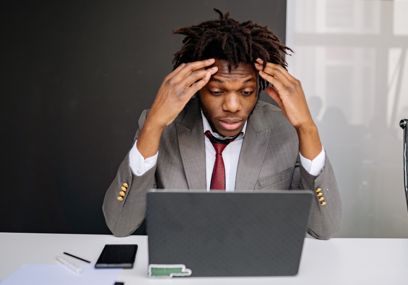 Server rack with colorful fiber optic cables connected to ports.