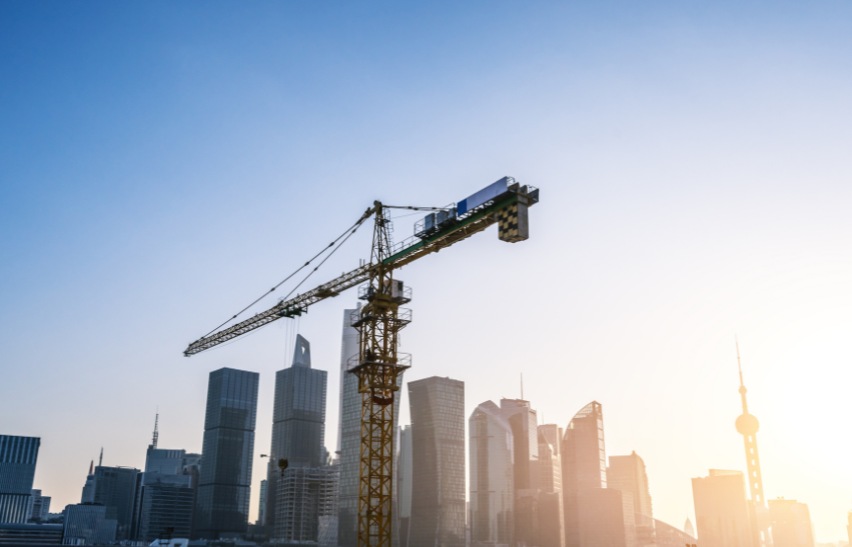 women wearing a hard hat looking out
