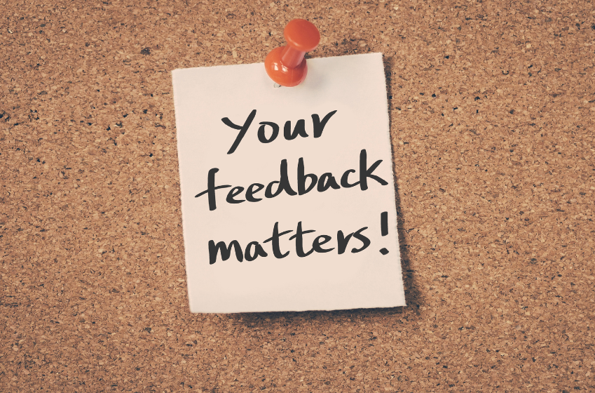 Server rack with colorful fiber optic cables connected to ports.