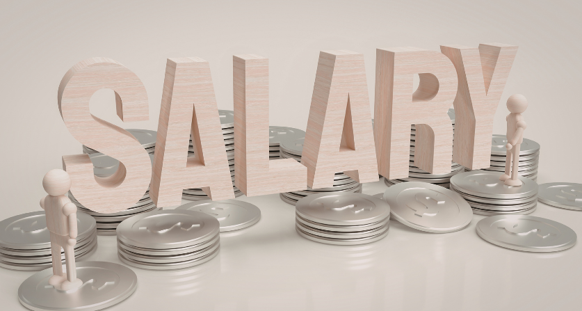 Wooden blocks arranged as a house and trees on a blueprint, promoting Sustainability Manager jobs.