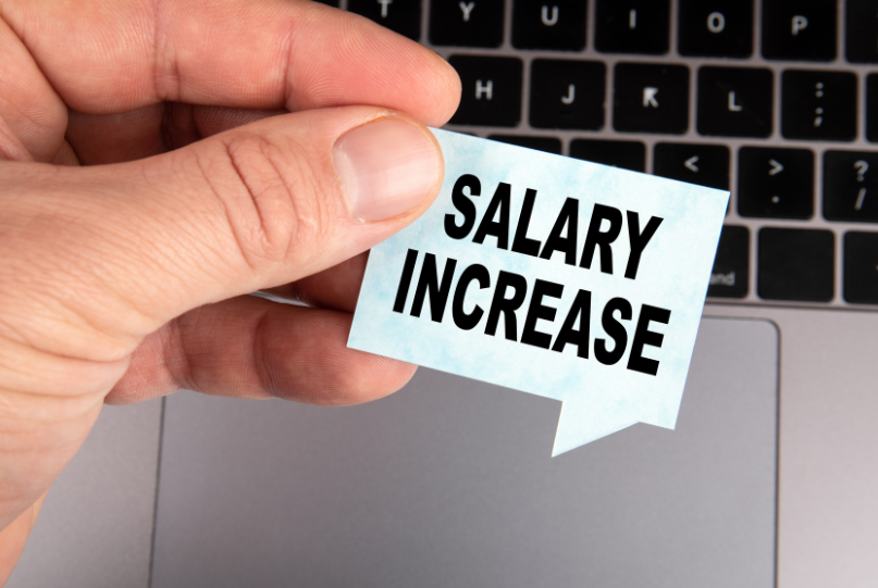 women wearing a hard hat looking out
