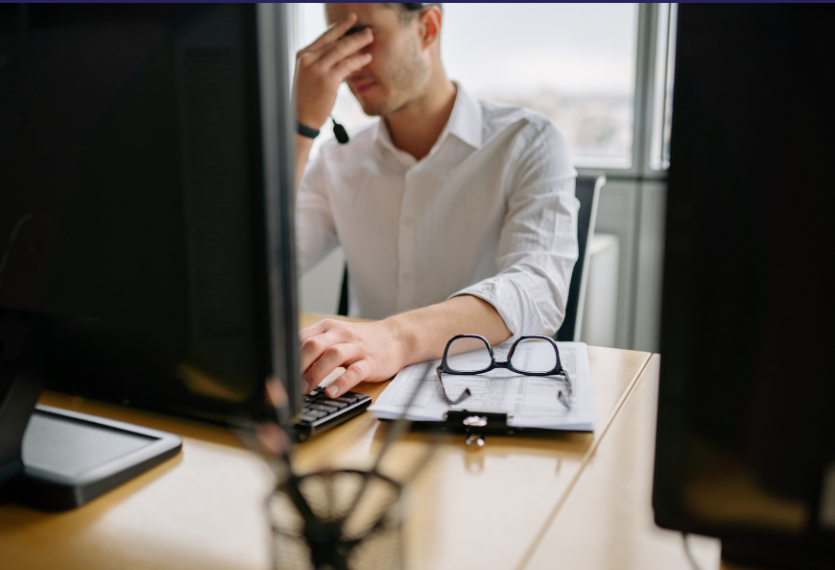 Server rack with colorful fiber optic cables connected to ports.