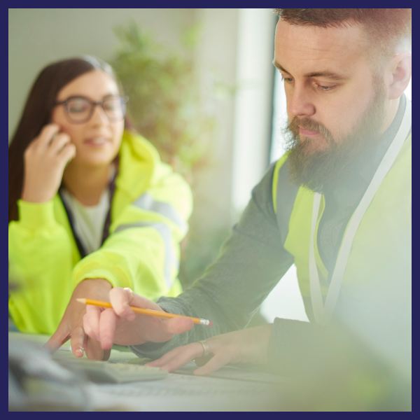 Wooden blocks arranged as a house and trees on a blueprint, promoting Sustainability Manager jobs.