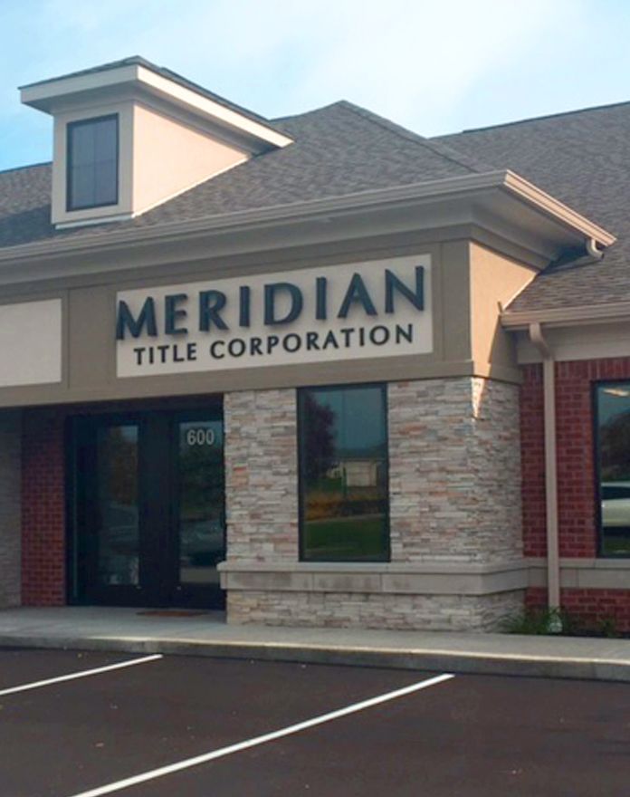 A building with a sign that says meridian title corporation