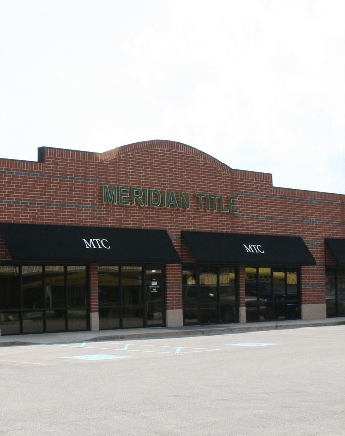 A brick building that says meridian title on it