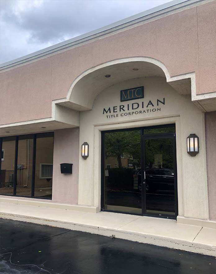 A building with a sign that says meridian title corporation