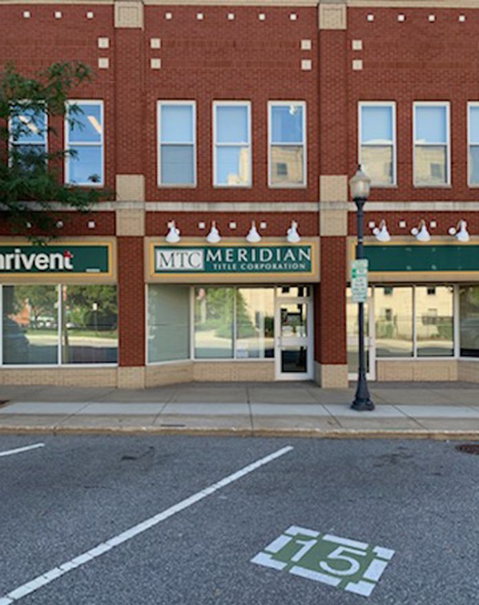 A brick building with the word meridian on it