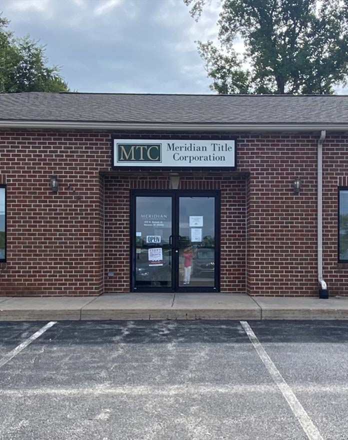 A brick building with a sign that says mtc on it