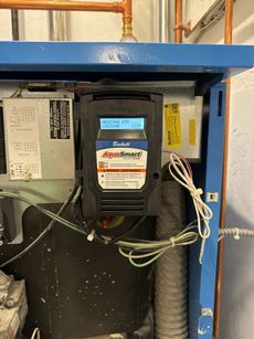 A blue box with a black device on top of it.
