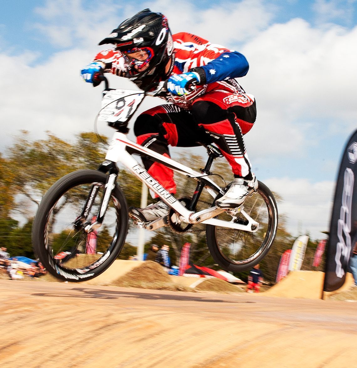 A person riding a bike with the number 91 on it